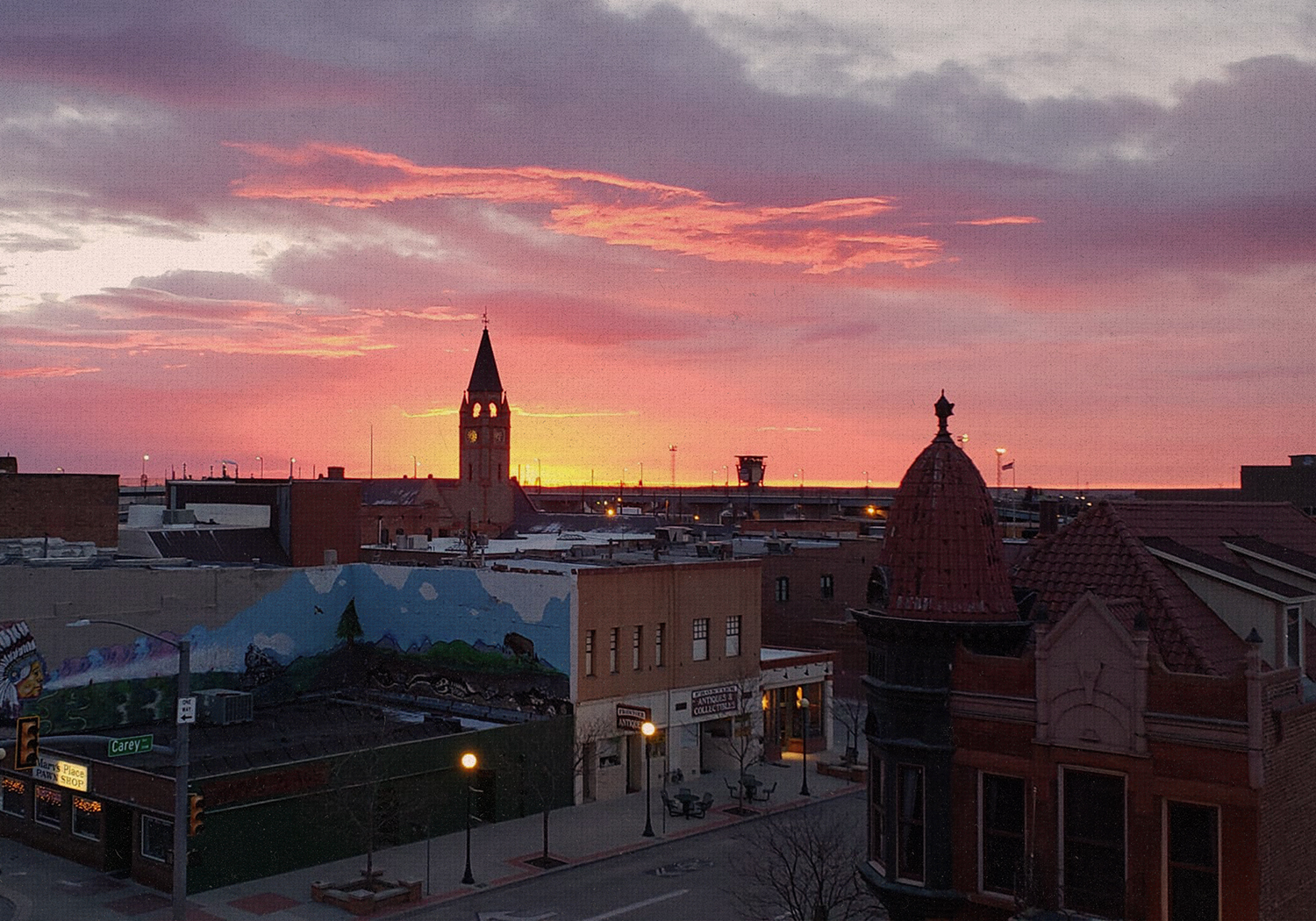 A pink sunset lights up the skyline of Downtown Cheyenne.