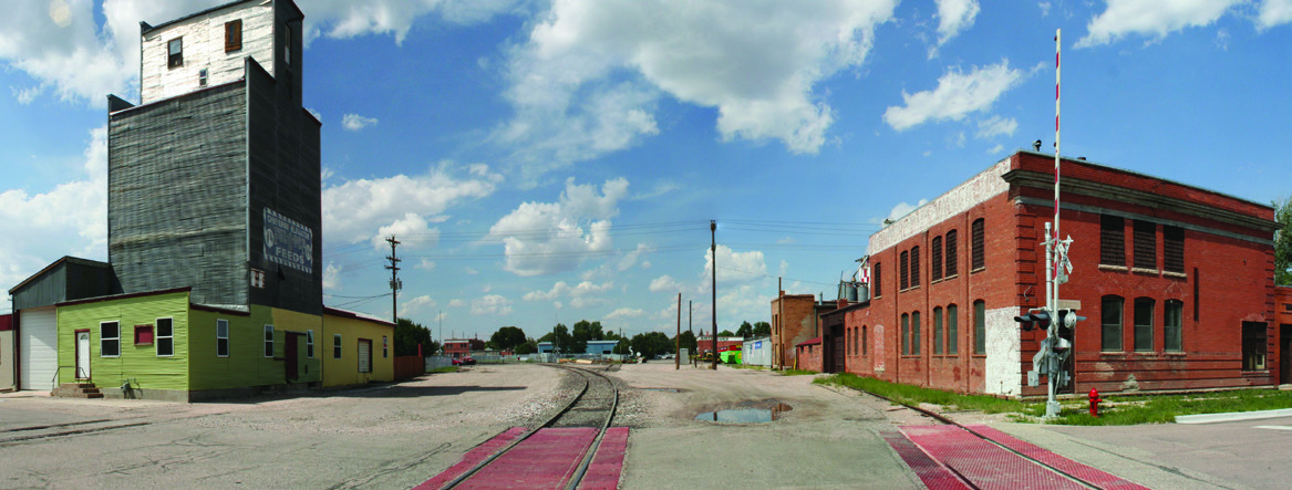 The Reed Avenue Rail Corridor, with buildings on both sides of railroad tracks.