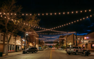17TH-ST-LIGHTS A street is illuminated by criss-crossing lights overhead.