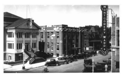 17TH-AND-WARREN-1930 An aerial street view of a Montgomery Ward sign and downtown buildings from the 1930s.