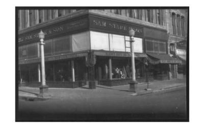 222-W-LINCOLNWAY-16TH-AND-CAREY-1931 A corner building, with merchandise in the front windows.