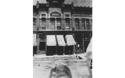 KNIGHTS-OF-PYTHIAS-1888 A street view of the Knights of Pythias building, with three awnings outside.