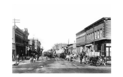 LINCOLNWAY A historic street view of Lincolnway, lined with horses and carriages.