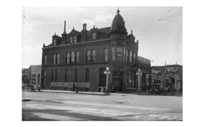 TIVOLI with sign on side A historic photo of The Tivoli building, with a sign along the side reading "Tivoli Mercantile Co."