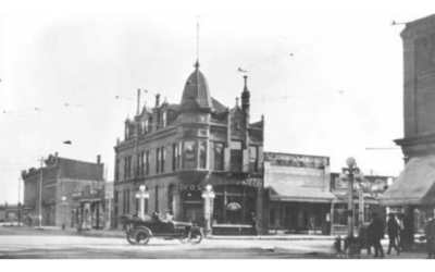 TIVOLI with Car A historic photo of an antique vehicle driving past the Tivoli Building in Downtown Cheyenne.