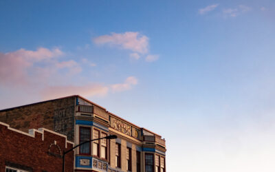 Lincolnway at Sunset A street view of Lincolnway at sunset, with a backdrop of blue sky behind a row of buildings.
