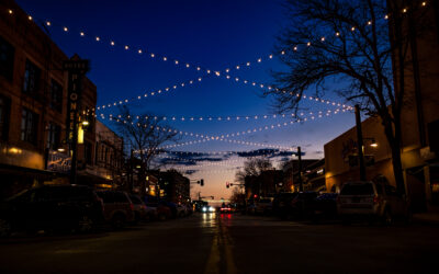 17th Street Lighting A darkened street view of 17th Street in Downtown Cheyenne, showing string lights overhead.