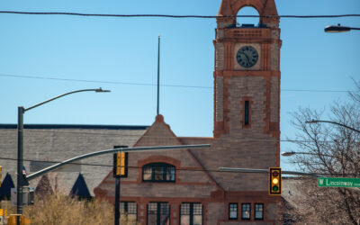 Clock Tower with Trolley View of the Cheyenne Depot Clock Tower, with a trolley coming up the street toward the camera.