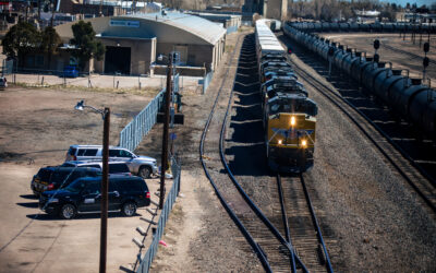 Train on tracks Aerial view of train tracks, with a train approaching the camera.