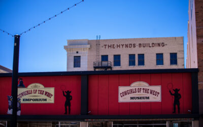 Cowgirls of the West Exterior signage for Cowgirls of the West museum, with Hynds building rising behind.