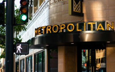 The Met Street view of The Metropolitan, with lit exterior signage.