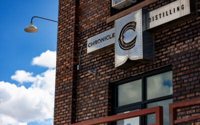 Chronicles Distilling Brick exterior with signage for Chronicles Distilling