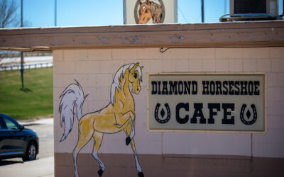 Diamond Horseshoe Close-up view of exterior signage for The Diamond Horseshoe Cafe