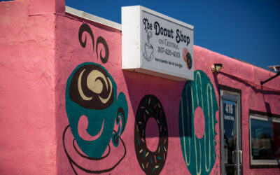 The Donut Shop Exterior view of The Donut Shop, a pink building painted with donuts