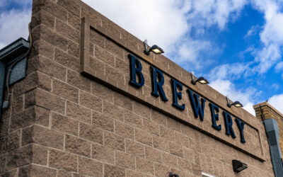 Freedom’s Edge Exterior of a stone building with BREWERY signage above the doorway