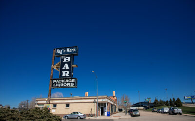 Keg’n Kork – Street View Street view of the sign for Keg'n Kork bar and package liquors