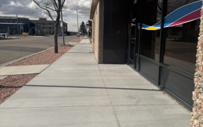 HEALTH WORKS 17TH STREET A sidewalk passes the front of a building.