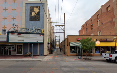 Lincoln Theatre A downtown street with building facades and open alleyway.